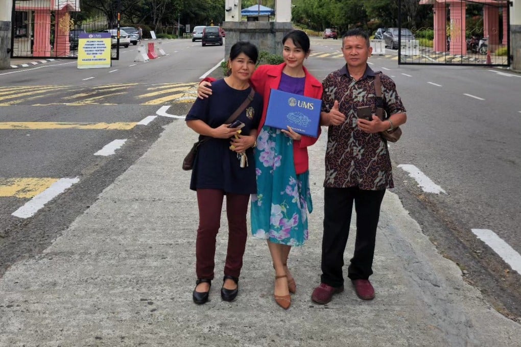 Veveonah Mosibin (centre) with her parents in Sabah. Photo: Facebook/veveonah.mosibin