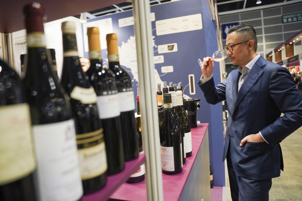 Visitors browse and taste wines from all over the world at the 16th Hong Kong Wine & Spirit Fair at the Hong Kong Convention and Exhibition Centre (HKCEC) in Wan Chai on November 7. Photo: Fan Chen