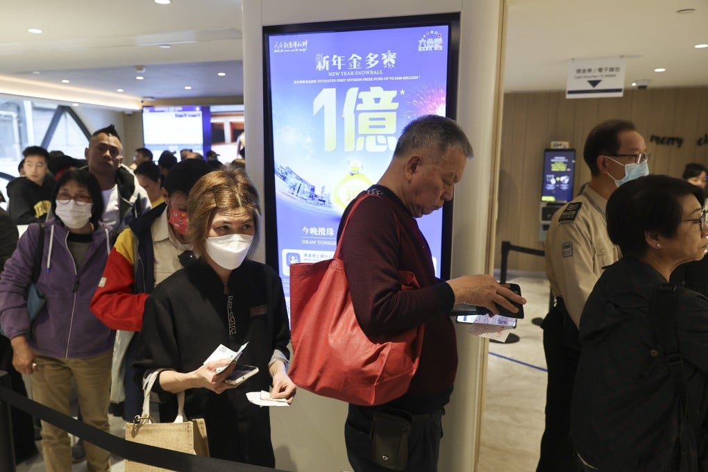 People queue to buy lottery tickets at a branch of the Hong Kong Jockey Club in the city’s Central business district for the Mark Six Snowball draw of HK$100 million on January 2, 2025. Photo: Edmond So