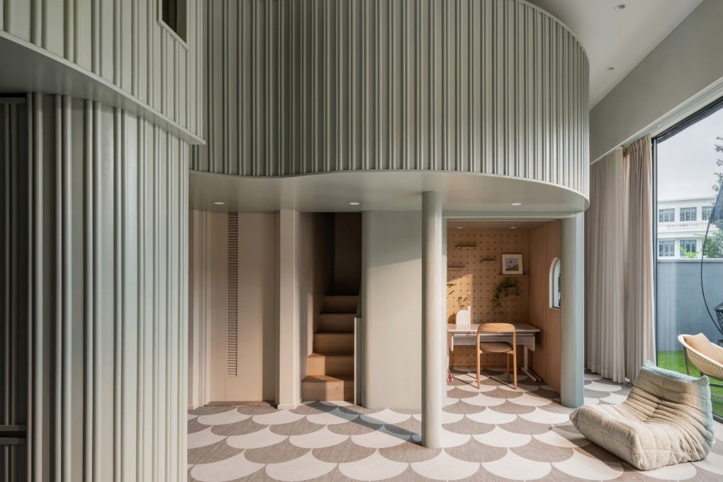 This triplex in Tuen Mun, Hong Kong, has a cavernous lower ground floor with a double-height ceiling. Photo: Steven Ko Photography