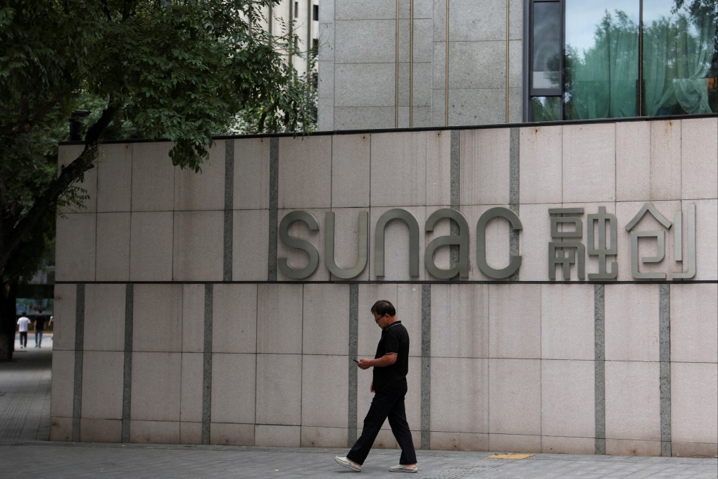 A man passed a Sunac logo in Beijing. Photo: Reuters