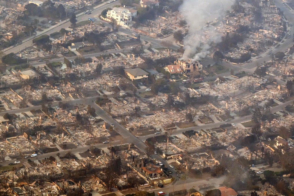 Homes smoulder near the Pacific Palisades neighbourhood of Los Angeles. Photo: AFP