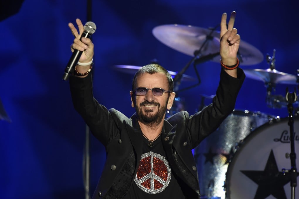 Ringo Starr flashes the peace sign to the crowd at the Reading Eagle Theatre in Pennsylvania. The former Beatles drummer is releasing his second country album. Photo: Getty Images