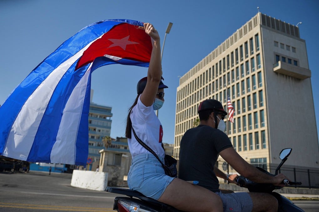 Cubans drive past the US embassy in Havana in March 2021. US embassy personnel in the city were the first to raise concerns, which later led the series of health effects to be dubbed “Havana Syndrome”. Photo: AFP