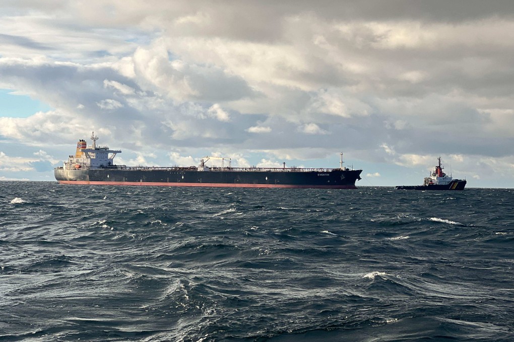 The tanker ‘Eventin’, flying the Panama flag, as a towing connection is established from the emergency tug boat Bremen (right) at sea north of the German Baltic Sea island of Ruegen, on Friday. Photo: AFP
