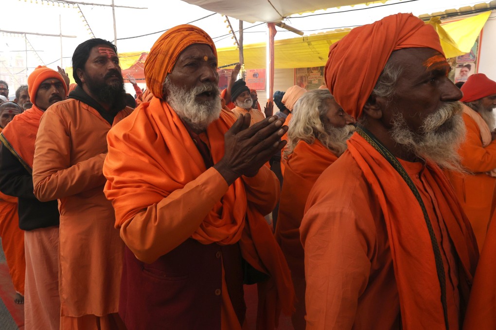 Members of Taponidhi Shri Anand Akhara Panchayati pray ahead of the royal bath near the Sangam, on Sunday. Photo: EPA-EFE