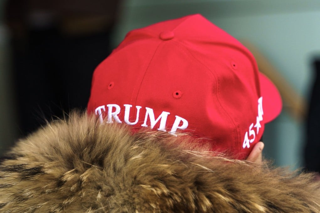 A resident wearing a Maga hat stands in front of the Hotel Hans Egede during Donald Trump Jnr’s visit to Nuuk, Greenland, on Tuesday. Photo: EPA-EFE