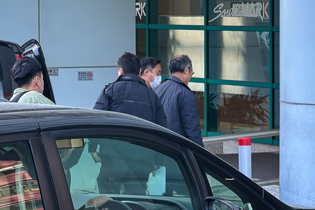 President of the Hong Kong Public Opinion Research Institute Robert Chung (3rd left) has been taken away for investigation. Photo: handout