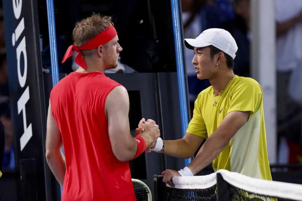 China’s Jerry Shang (right) shakes hands with Davidovich Fokina of Spain after retiring early during their first-round match. Photo: Xinhua