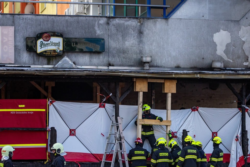 Firefighters and security forces check the scene of the burnt restaurant damaged by a propane-butane cylinder explosion in Most, Czech Republic on Sunday. Photo: EPA-EFE