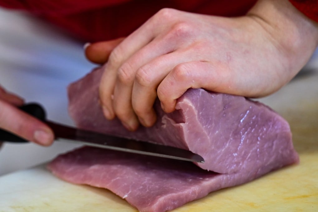 A German butcher prepares pork. South Korea’s Ministry of Agriculture has banned all pork imports from Germany after a recent outbreak of foot-and-mouth disease. Photo: dpa