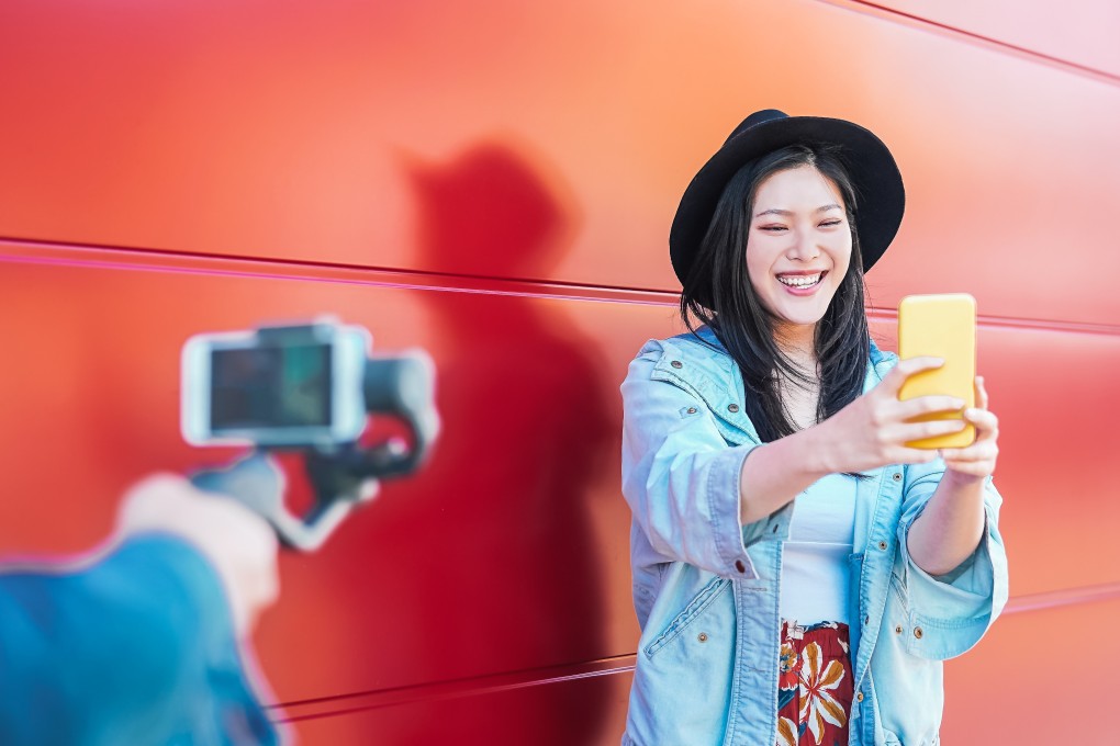 Vloggers on Instagram, YouTube and TikTok are selling unused footage to AI video companies to diversify their income streams. Photo: Shutterstock