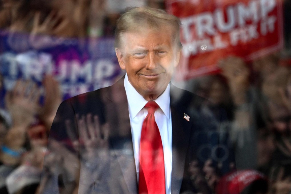 Donald Trump behind bulletproof glass on the campaign trail in 2024. File photo: AFP
