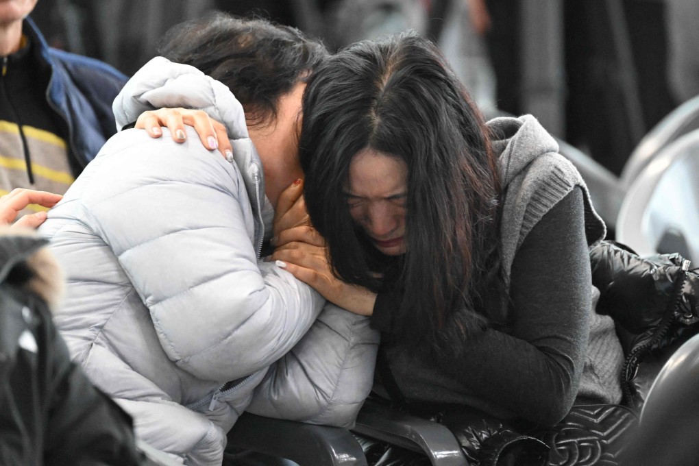 Women grieve at the Muan International Airport in South Korea after the Jeju Air crash on December 29, 2024. Photo: AFP