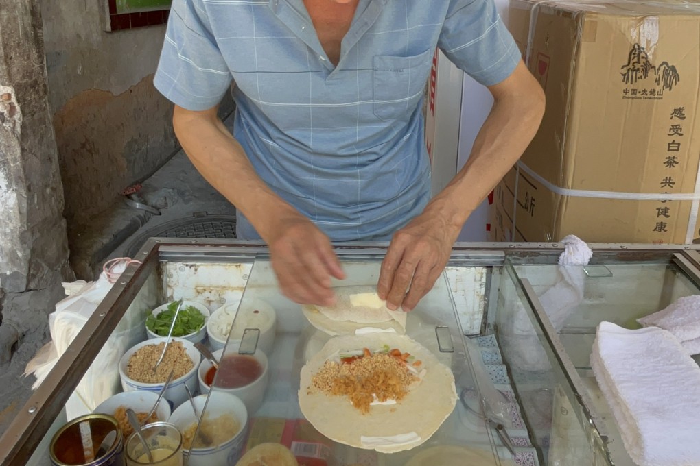 A local favourite in Xiamen, Fujian province, southeast China, stuffed pancakes are made at a street stall. Photo: Pin Yen Tan
