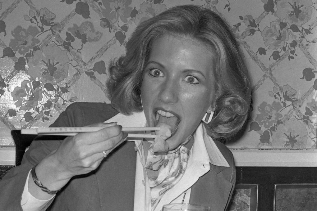 American visitor Ellen Clark enjoys dim sum in a local Hong Kong restaurant in 1977. Photo: SCMP