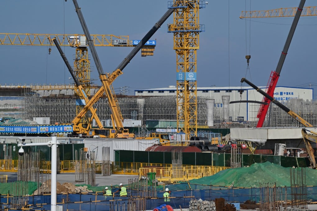 Construction work is done in October at an airport in China’s Fujian province, which expects its economy to grow by at least 5-5.5 per cent this year. Photo: AFP
