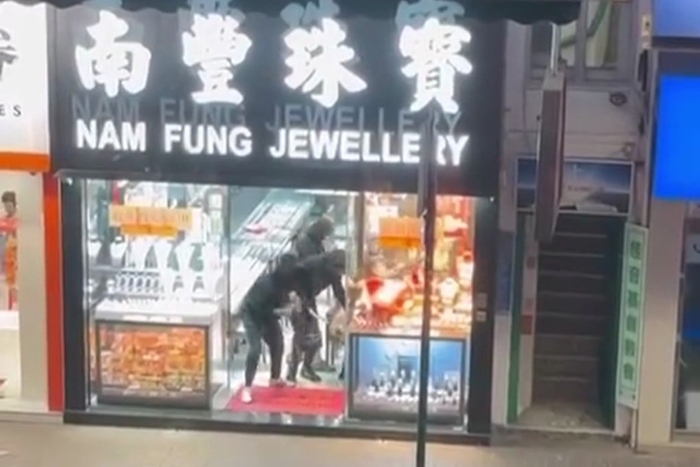 Robbers can be seen grabbing valuables from display cabinets before fleeing in a video circulating online. Photo: Handout