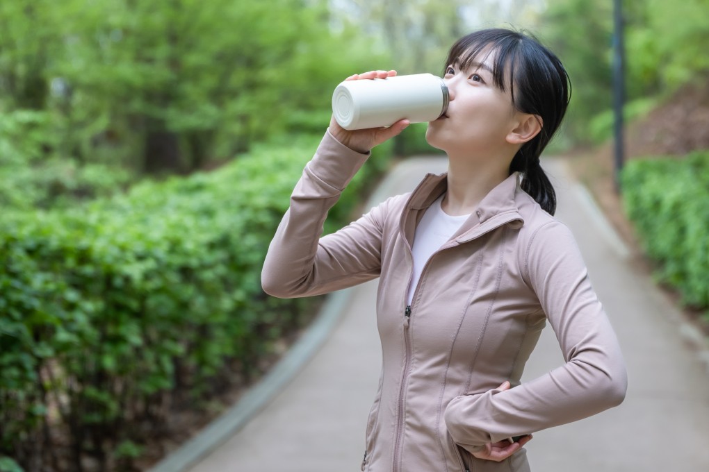 A woman drinking from a tumbler. Photo: Shutterstock