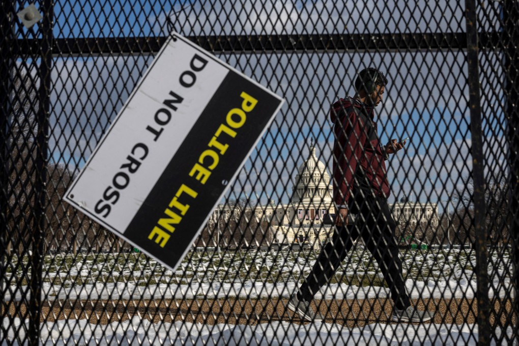 A man walks past security fencing near the US Capitol in Washington. Photo: Reuters