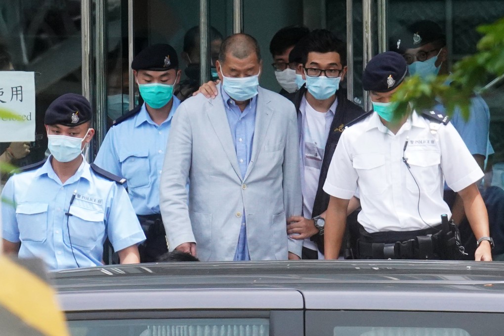Prosecutors have accused Jimmy Lai (centre) of using his tabloid to instigate Western sanctions and incite public hatred towards mainland and Hong Kong authorities. Photo: Winson Wong