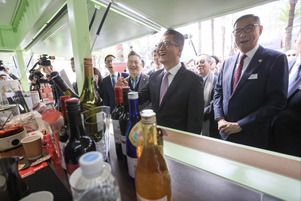 Financial Secretary Paul Chan Mo-po (centre) visits the 58th Hong Kong Brands & Products Expo at Victoria Park on December 14. His track record is excellent and green shoots of recovery are in abundance. Photo: Jonathan Wong