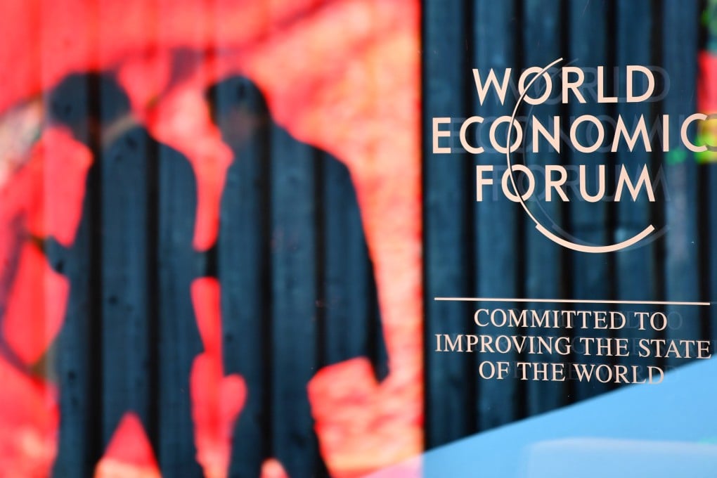 People walk past the logo of the World Economic Forum in Davos, Switzerland, on January 14, 2024. Photo: Xinhua