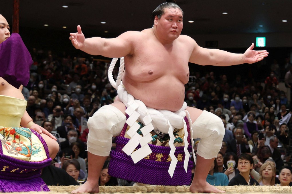 Mongolian-born grand champion Terunofuji (right) entering the ring at the New Year Grand Sumo Tournament in Tokyo on Tuesday. He withdrew from the tournament on Thursday after forfeiting his bout. Photo: AFP