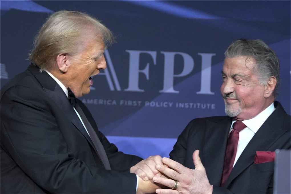 US president-elect Donald Trump greets actor Sylvester Stallone at Mar-a-Lago in November. Photo: AP