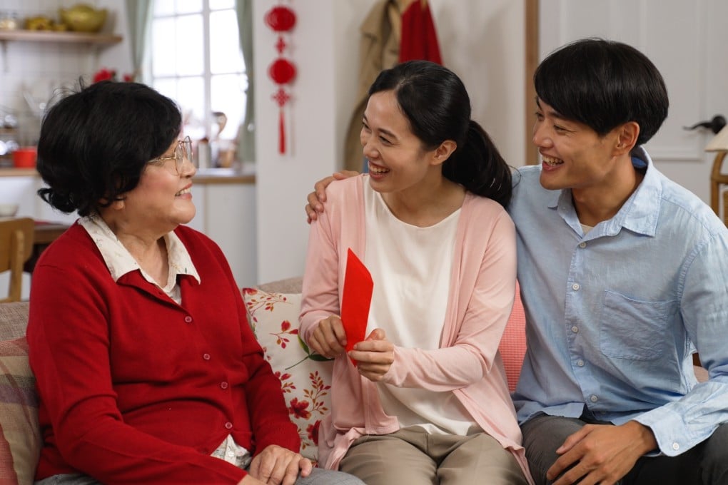 The red colour of lai see symbolises good luck and prosperity, and the amount of money inside usually ends in an even number, which is considered more auspicious. Photo: Shutterstock