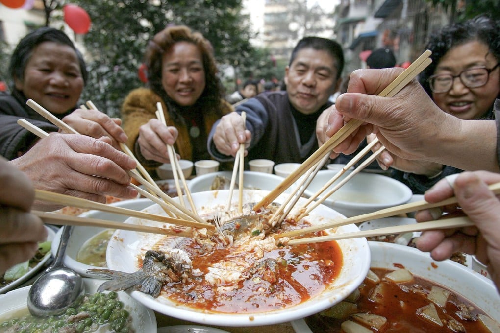 People in Chengdu, southwest China, enjoy a Lunar New Year feast. There are auspicious foods to eat during the festival, and others you should avoid if you want good fortune in the new lunar year. Photo: Getty Images