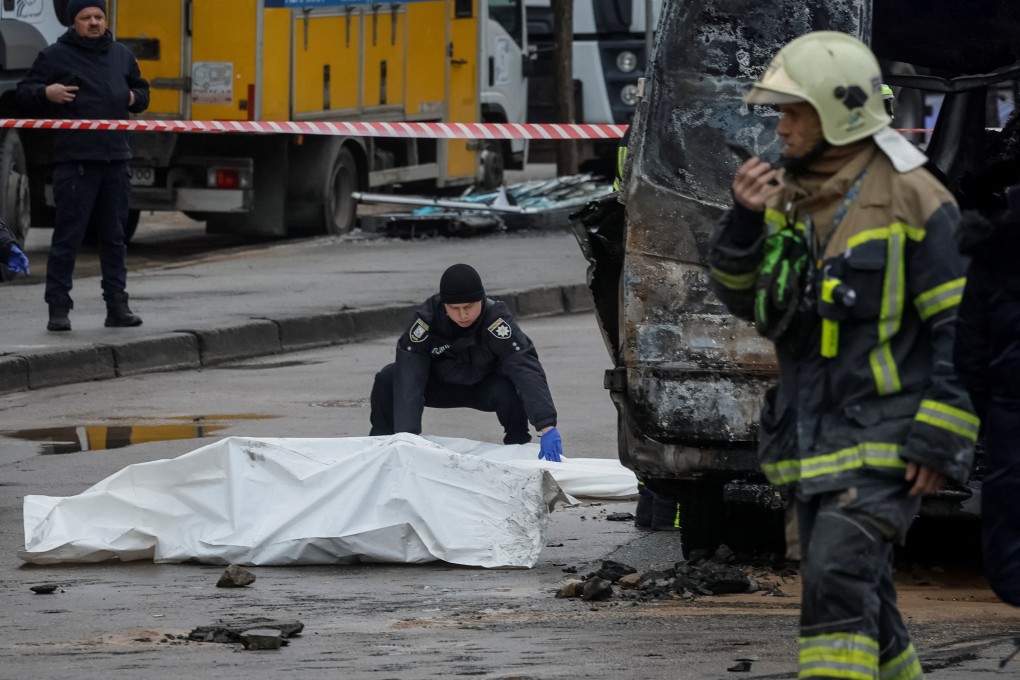 A police officer closes a bag with the body of a person killed by Russian missile strikes, amid Russia’s attack on Ukraine, in Kyiv, Ukraine, on Saturday. Photo: Reuters