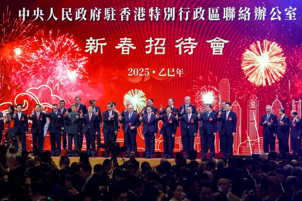 Dignitaries raise a glass at the liaison office’s reception on Friday. Photo: Nora Tam