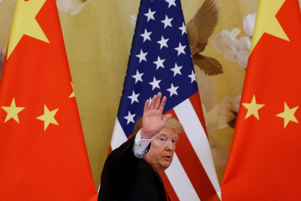 US President Donald Trump waves during a joint press event with China’s President Xi Jinping at the Great Hall of the People in Beijing in November 2017. Photo: Reuters