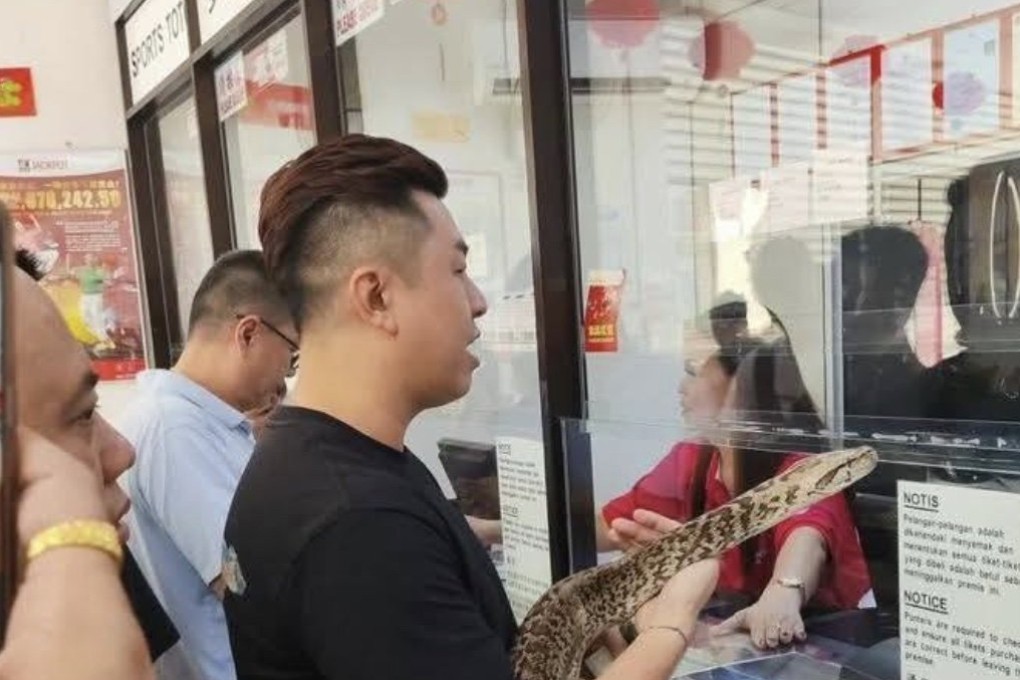 A man shows up at a Sports Toto shop in Kuching, Malaysia, over the weekend to place a bet to win a record US$27.7 million jackpot. Photo: The Daily News Zone/Facebook