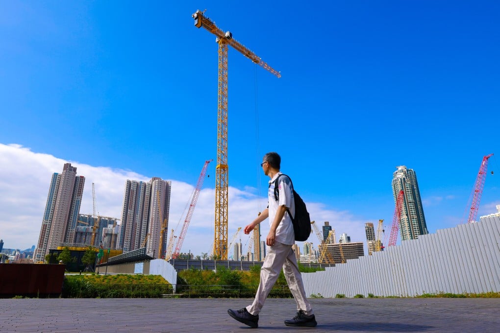 A man walks past construction in Kai Tak. Photo: Nora Tam