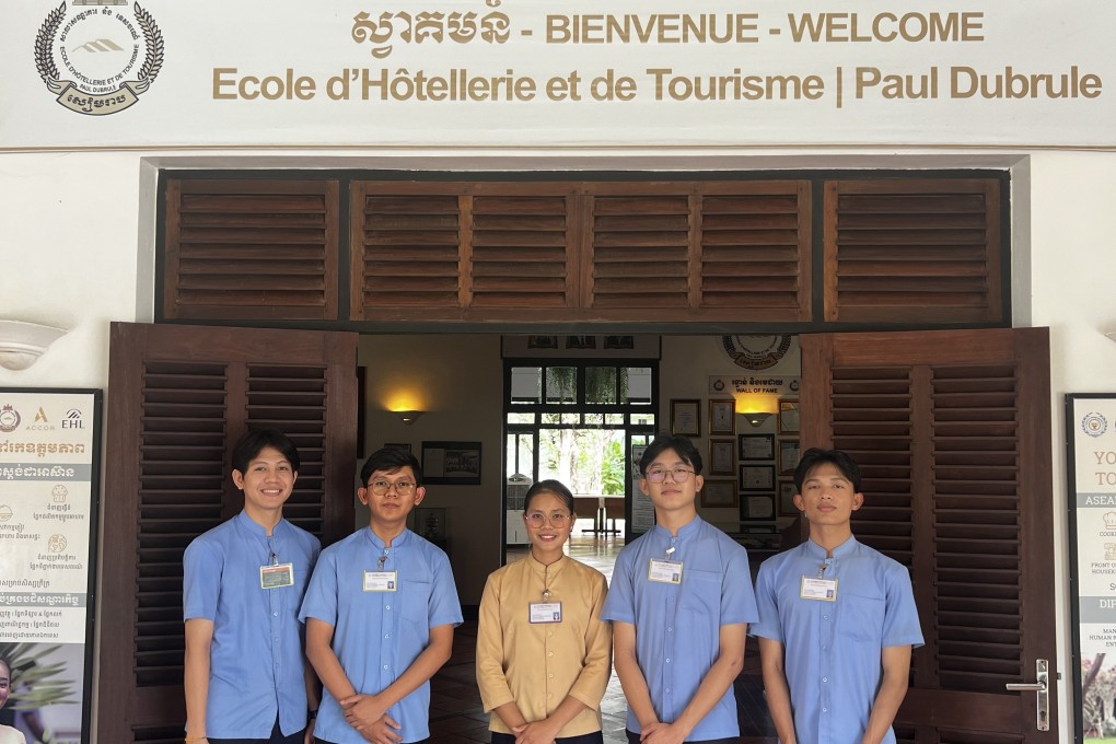 Hospitality students at the entrance to the École d’Hôtellerie et de Tourisme Paul Dubrule, opened in Siem Reap, Cambodia, 23 years ago by the Accor hotels group co-founder. Photo: Erika Na