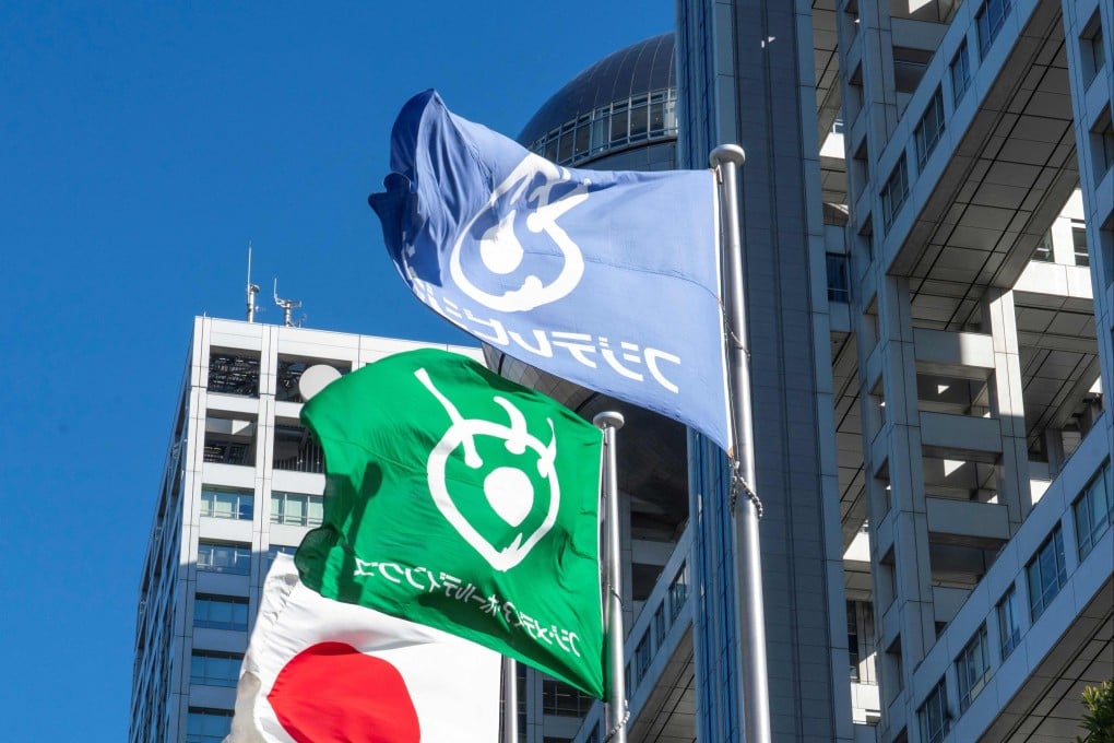 Flags of Japanese broadcaster Fuji Television Network are seen in front of the company’s building in Tokyo. Photo: AFP