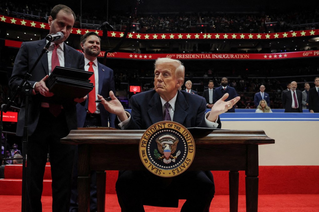 US President Donald Trump gestures as he signs executive orders on the inauguration day of his second presidential term, in Washington, on Monday. Photo: Reuters