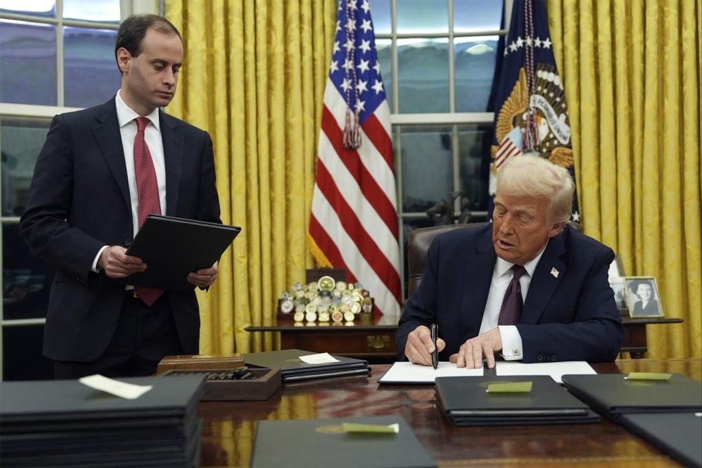 US President Donald Trump signs an executive order on TikTok in the Oval Office on Monday. Photo: AP