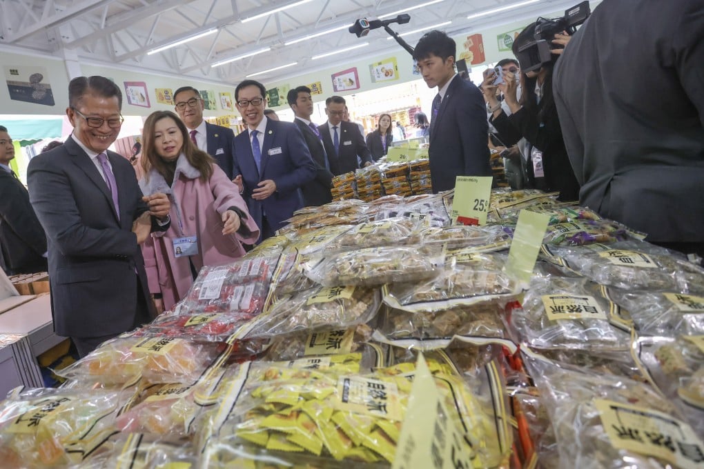 Financial Secretary Paul Chan Mo-po, left, visits the 58th Hong Kong Brands & Products Expo at Victoria Park on December 14, 2024. Photo: Jonathan Wong