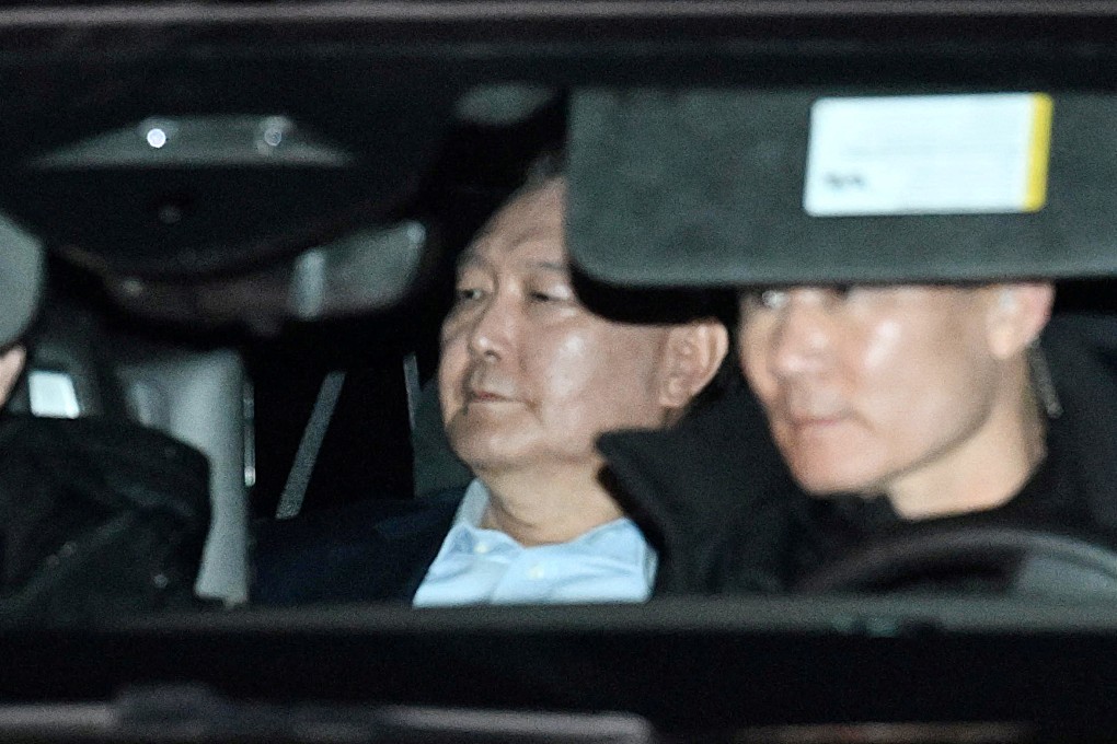 South Korea’s impeached President Yoon Suk-yeol sits as he is wheeled away for detention on January 15, 2025. Photo: Yonhap via Reuters