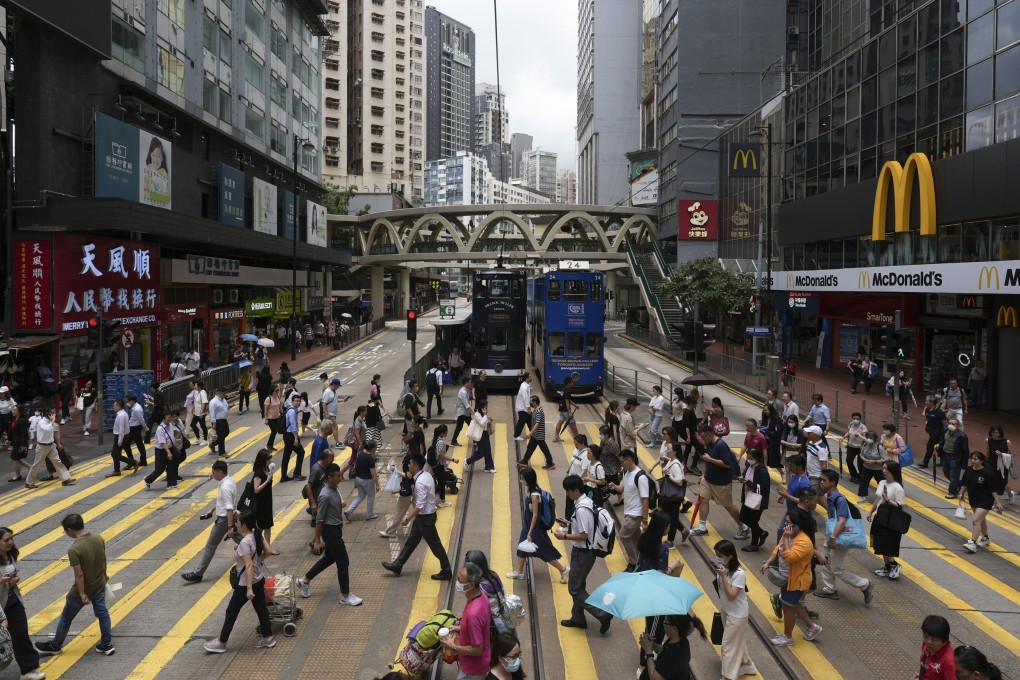 People cross the street in Hong Kong’s shopping hub, Causeway Bay. Photo: Eugene Lee