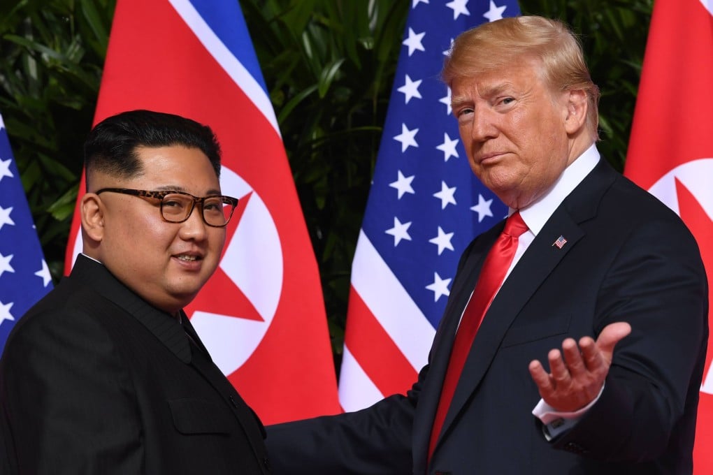 US President Donald Trump gestures as he meets North Korean leader Kim Jong-un at the start of their historic first summit in Singapore in 2018. Photo: AFP