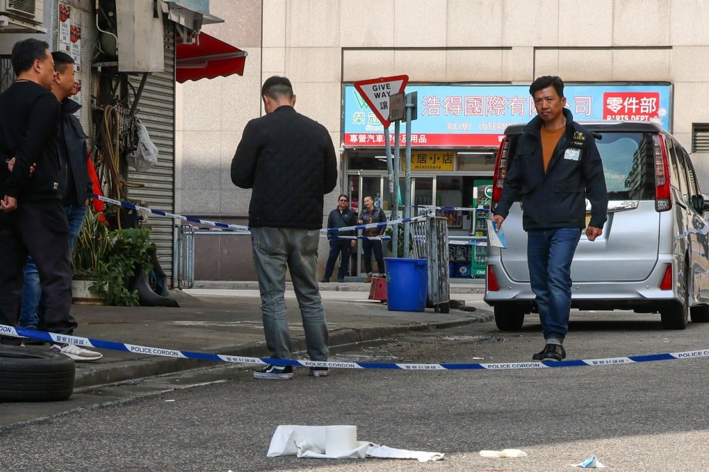 Police officers investigate outside the Hi Yip Factory Building on Hi Yip Street in Yuen Long. Photo: Jelly Tse