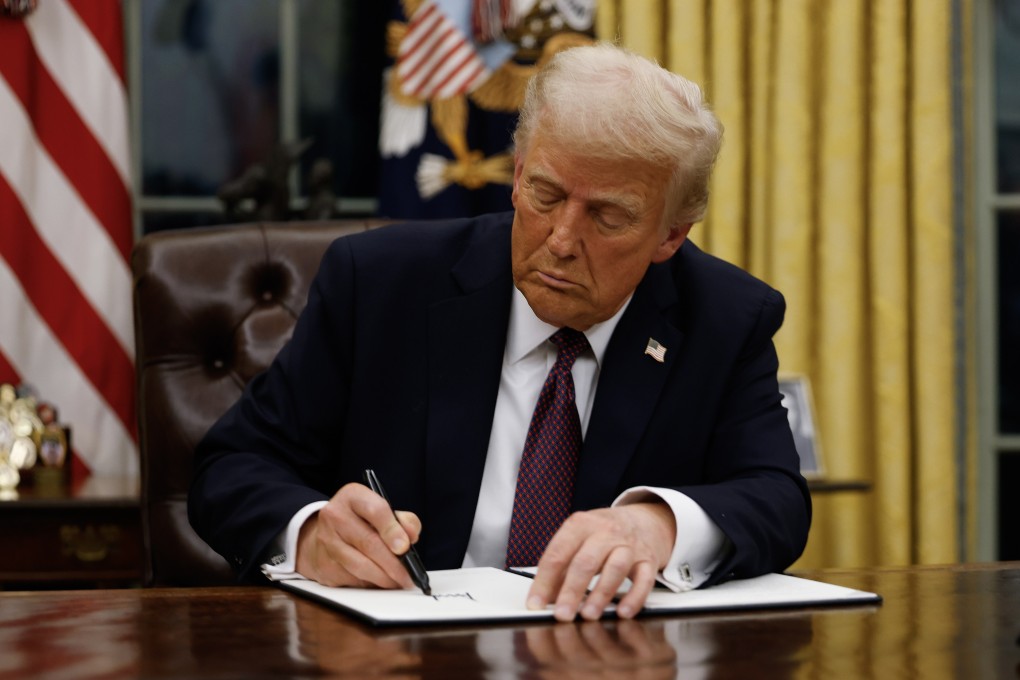 US President Donald Trump signing executive orders at the White House on Monday. Photo: Getty Images/TNS