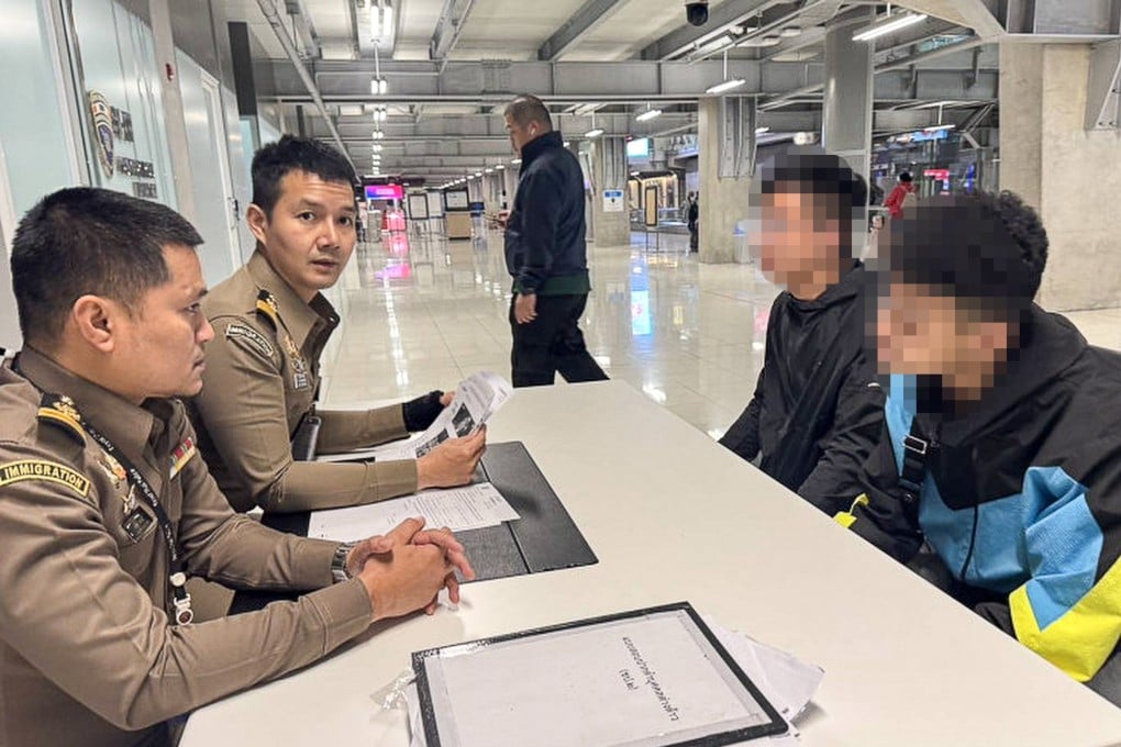 Thailand immigration police speak to suspects fleeing a murder case in Hong Kong at Suvarnabhumi Airport on Wednesday. Photo: Handout