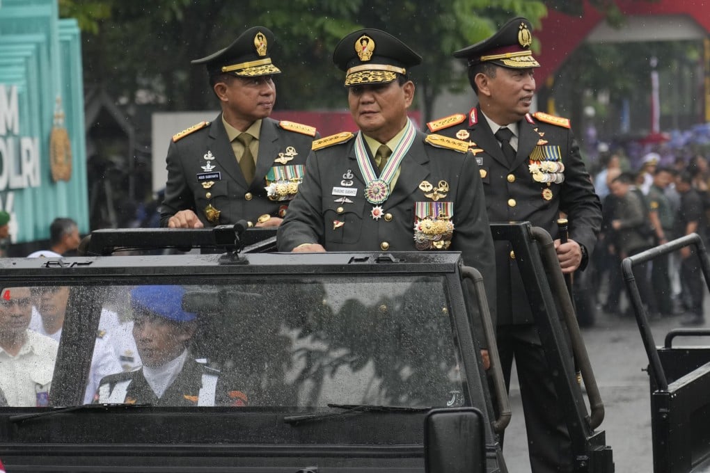 Prabowo Subianto (centre) parades through Jakarta with other defence officials last year before becoming president. Photo: AP