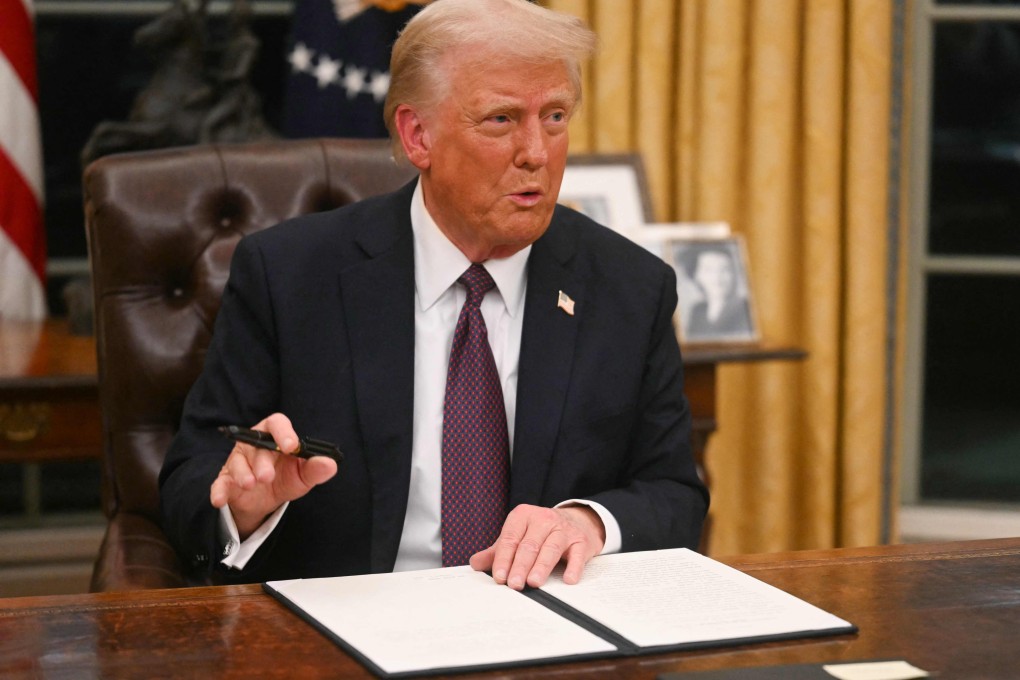 US President Donald Trump signs an executive order on the US withdrawal from the WHO on Monday. Photo: AFP