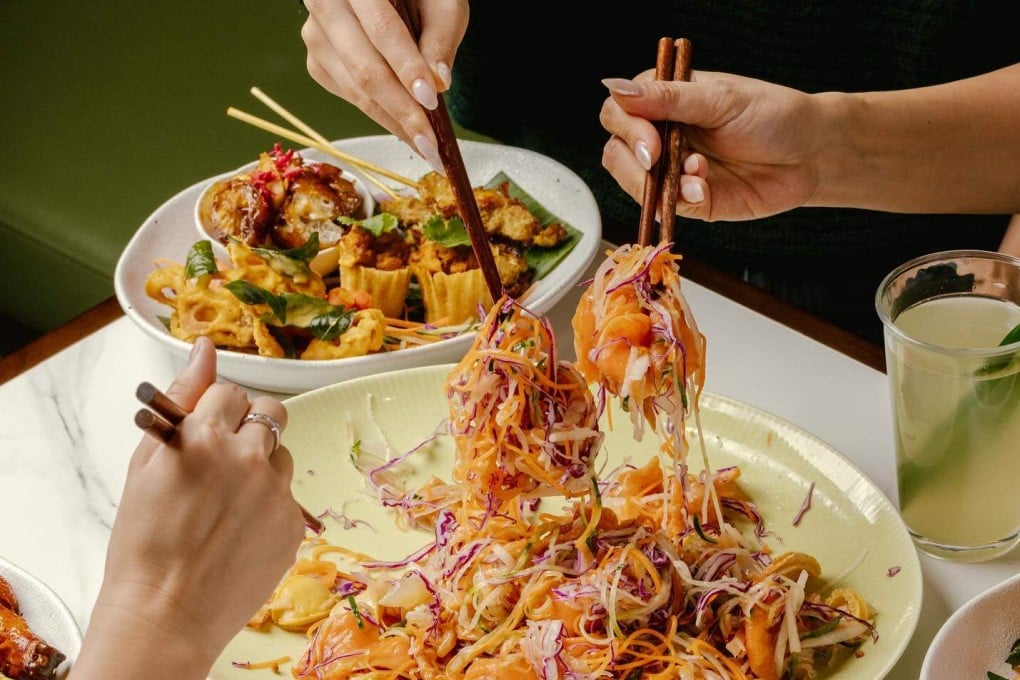 The prosperity toss salad, called yusheng or lo hei in Chinese, served at Jom, a modern Singaporean restaurant in Hong Kong. Diners mix and toss the salad while repeating Chinese new year good luck sayings. Photo: Instagram/@eat.jom